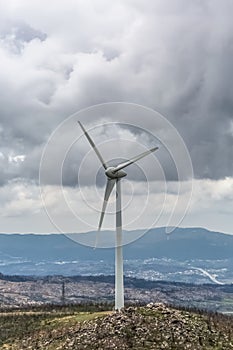 View of a wind turbines on top of mountains