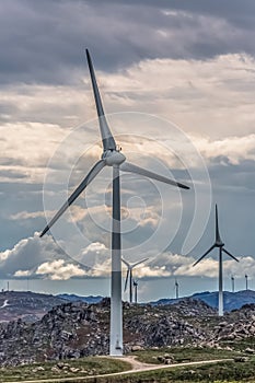 View of a wind turbines on top of mountains