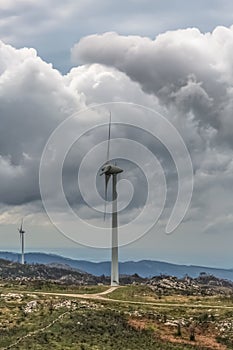 View of a wind turbines on top of mountains