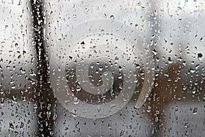 View through window with abstract texture of raindrops