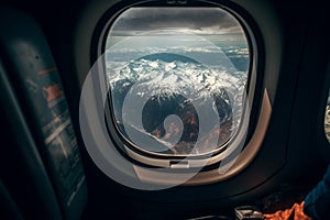 A view from the window of an airplane. Flying over the ground, view over an abyss, flying . Beautiful scenic view of