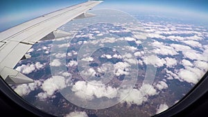 View From Window Of Airplane On Wing Of Aircraft Flight, Sun`s Rays And Clouds