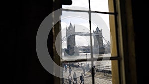 View from window of British bridge. Action. Inside apartment there is beautiful view from window of tower bridge with