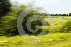 View from the window of a fast moving train