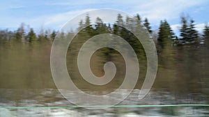 View from the window of a fast-moving train