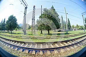 A view from a window of a moving train shot on a wide-angle lens