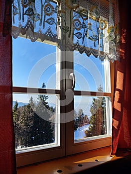 View from the window od a challet to the nature on the mountain during winter.