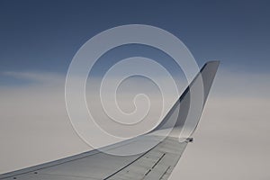 The view from the window of the plane in the airborn above the clouds