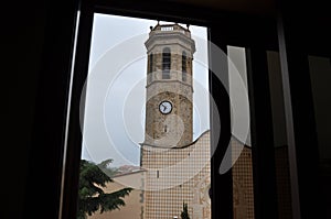 View from the window to the bell tower with the clock.