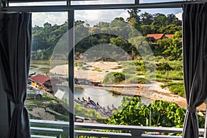 View from window to the Tembeling river in Kuala Tahan village, Taman Negara national park, Malays