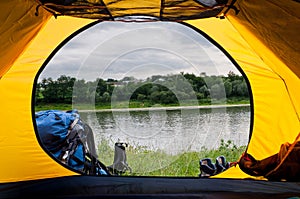 The view from the window of tourist tents on the shore of the ri