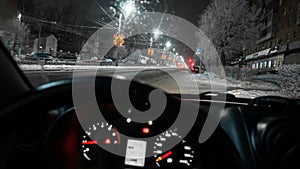 View through the windshield of the car on the festive decoration of the city.