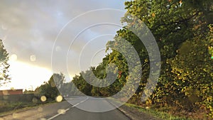 The view through the windshield of the car in heavy rain in a Sunny weather