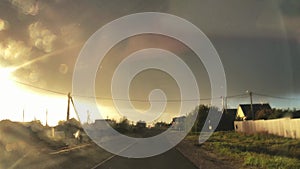 The view through the windshield of the car in heavy rain in a Sunny weather