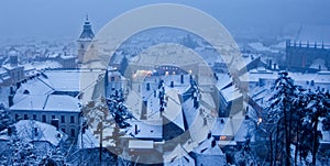 view of a Winter day over the city of Brasov Romania snow