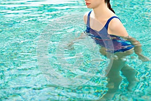 View of woman swimming in swimming
