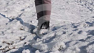 View of Women Legs Walking by Snow in Winter Forest in Slow Motion