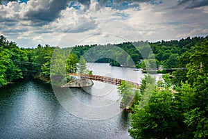 View of wooden bridge over the Piscataquog River, from the Pinard Street Bridge in Manchester, New Hampshire.