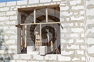 view of the wooden formwork with metal holders, which will be filled with the overlap between the floors in the country house