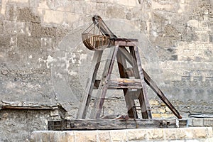 Wooden Medieval Catapult. Ballistic Device. Ancient Military Technology