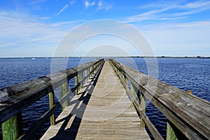A wooden pier by the blue ocean near Punta Gorda, Florida, U.S photo