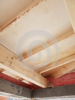 view of wooden rafters when installing roof on construction of house