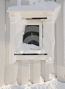 View of wooden snowy window