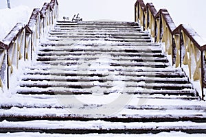 View of Wooden stairs on the winter hill. in Arkhangels