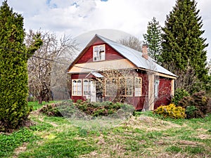 view of wooden summer house in village in spring