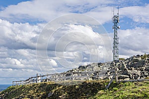 View of the wooden walkway and telecommunication tower on the top of Levitunturi, Kittila, Lapland, Finland photo