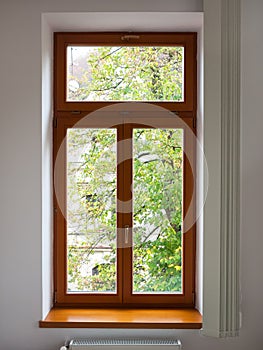 View of a wooden window from the inside