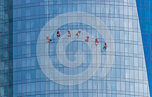 View of Workers Cleaning a Highrise Building