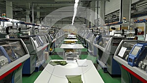 View of working knitting machine in workshop.