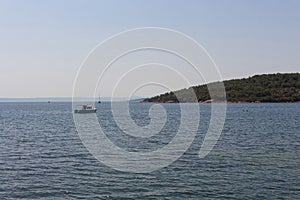 View of a yacht, Aegean sea and landscape captured in Ayvalik area of Turkey.