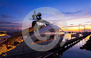 View of the yacht club and marina with large yachts at sunset in pattaya