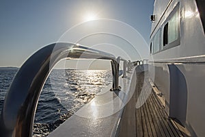 View from a yacht travelling at sunrise