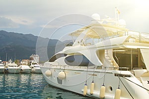 view of the yachts on the pier and the mountain in Budva in Mont
