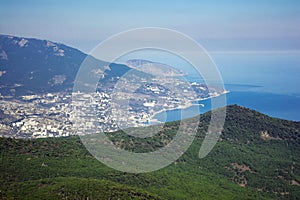 View of Yalta city, pine woods, Ayu-Dag mountain and Black sea from the top of Ai-Petri plato