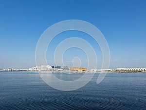 View of Yas Bay Waterfront with Etihad Arena, Formula One track and TwoFour 54 Building in Abu Dhabi