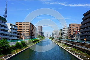 View of Yokojukken river and modern residential buildings . Tokyo, Japan