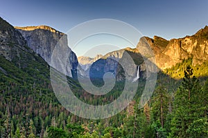 View of Yosemite Valley from Tunnel View point at sunset - view to Bridal veil falls, El Capitan and Half Dome - Yosemite National