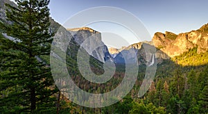 View of Yosemite Valley from Tunnel View point at sunset - view to Bridal veil falls, El Capitan and Half Dome - Yosemite National