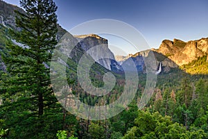 View of Yosemite Valley from Tunnel View point at sunset - view to Bridal veil falls, El Capitan and Half Dome - Yosemite National