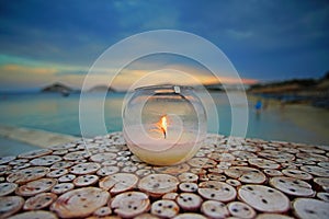 Nightview with a candle that you can admire after sunset from Kalafaty beach,Mykonos, Greece