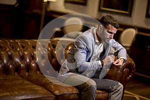 View at young man tasting white wine