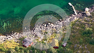 Viewed from above red wooden huts known as Rorbu