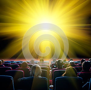 Viewers look at shining sun in cinema