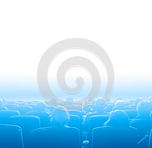 Viewers at movie theater, blue toning white copy space