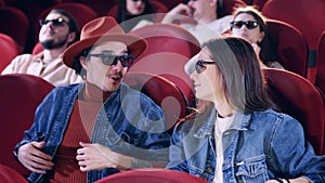 Viewers put on their 3D glasses at the movie theater