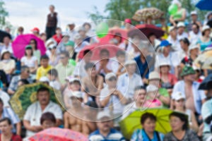 Viewers at stadium blurred